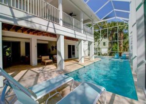 The pool area at a Sanibel Island vacation rental to relax at after exploring the island on bike rentals. 
